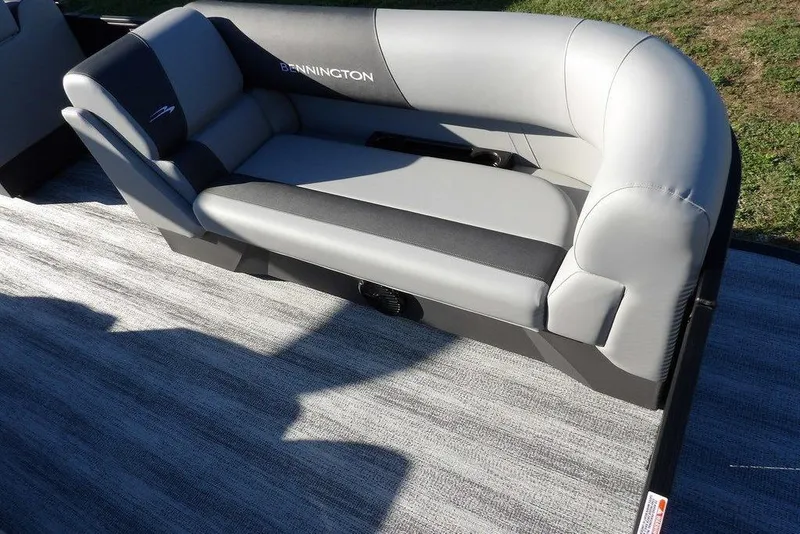 Slide: The Image of 2026 Bennington S L-Bench 22 SL boat seat, gray and black upholstery, outdoor setting. - 15
