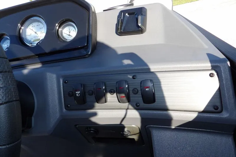 Slide: The Image of Dashboard controls of 2026 Bennington S L-Bench 22 SL boat with gauges and switches. - 18