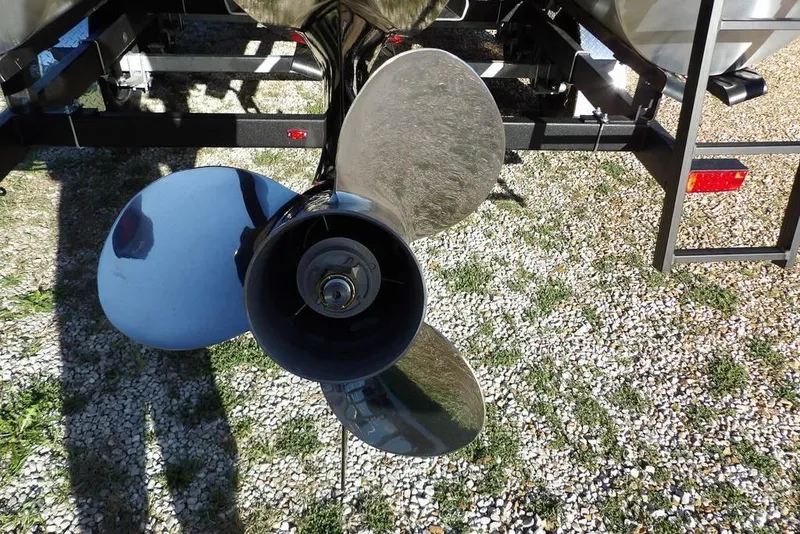 Slide: The Image of Propeller of 2026 Bennington S L-Bench 22 SL boat on gravel surface. - 32