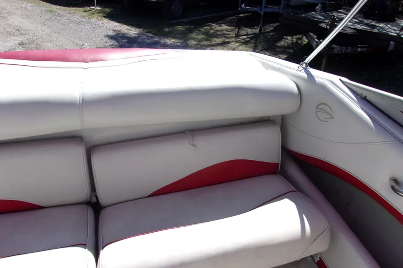 Slide: The Image of 2002 Crownline 202 BR boat interior with white and red seating. - 10
