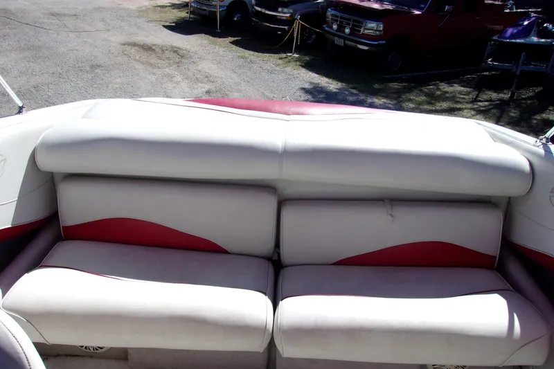 Slide: The Image of 2002 Crownline 202 BR boat interior with white and red seating. - 11