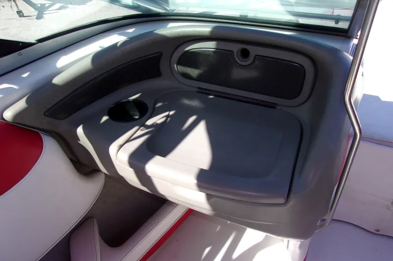 Slide: The Image of Interior of 2002 Crownline 202 BR boat with cup holder and seating area. - 6