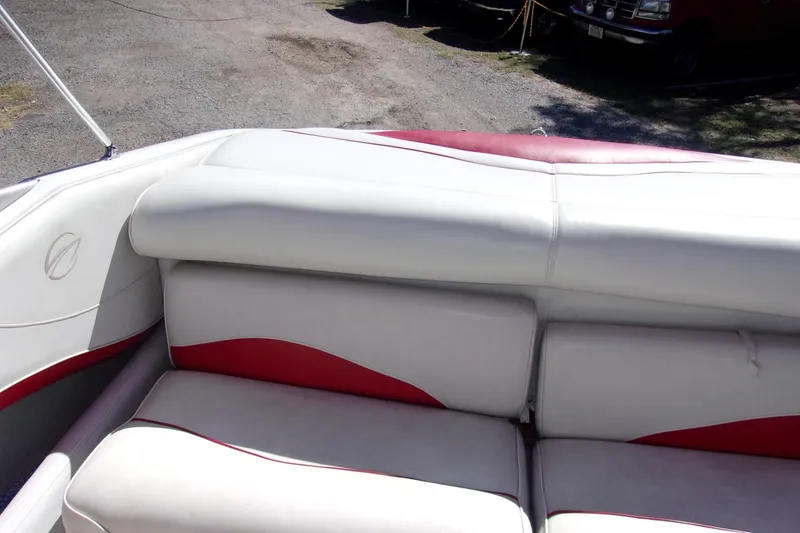 Slide: The Image of 2002 Crownline 202 BR boat interior with white and red seating. - 9
