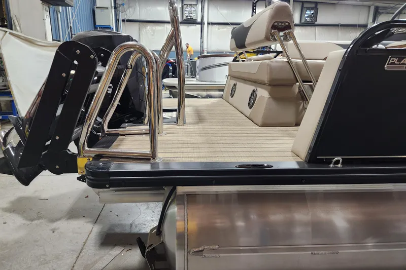 Slide: The Image of 2026 Avalon LSZ Cruise Rear Bench pontoon boat interior with seating and railing. - 3