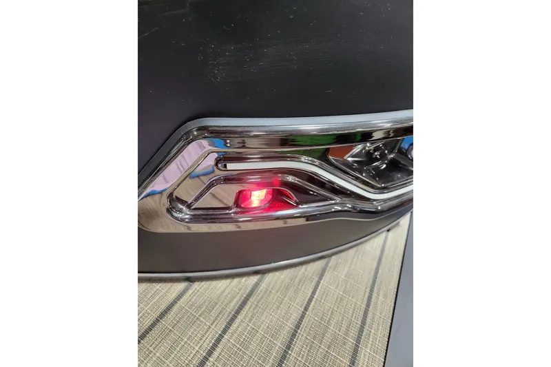 Slide: The Image of 2026 Avalon LSZ Cruise Rear Bench with sleek chrome detailing and red light. - 6