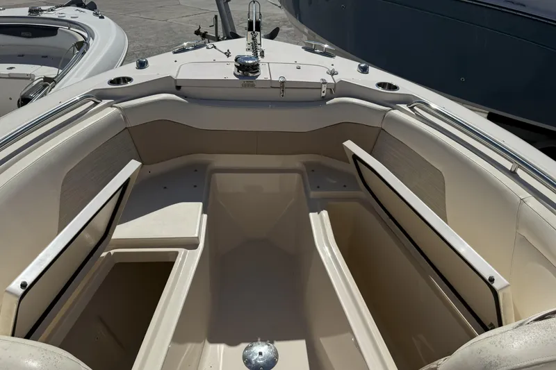 Slide: The Image of 2014 Grady-White Freedom 275 boat interior with seating and storage compartments. - 34