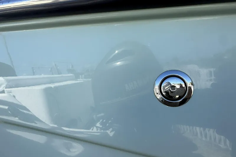 Slide: The Image of 2014 Grady-White Freedom 275 boat with chrome detail and reflection. - 48