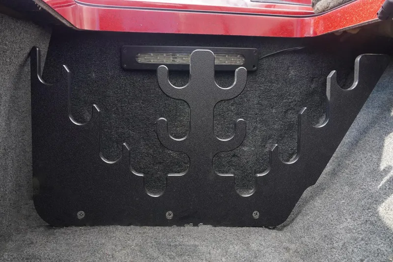 Slide: The Image of 2011 Ranger Z119 boat rod holder with black metal design and interior light. - 14