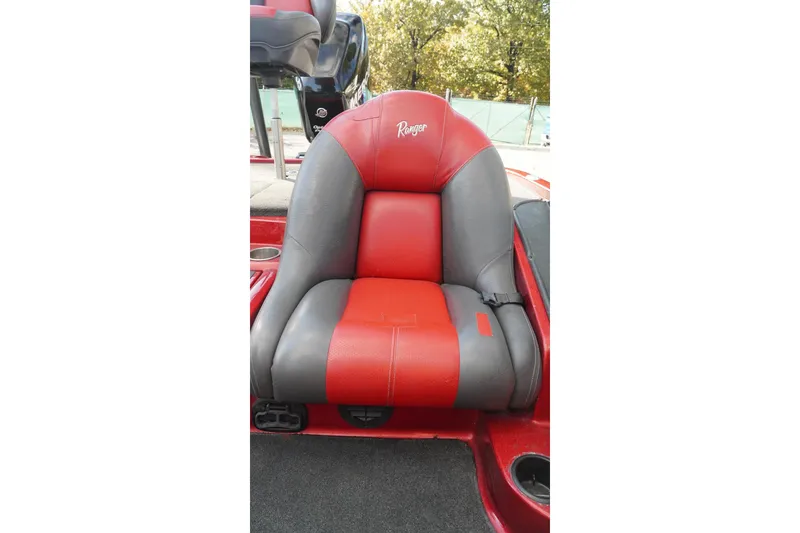 Slide: The Image of Red and gray seat of 2011 Ranger Z119 boat, outdoors. - 21