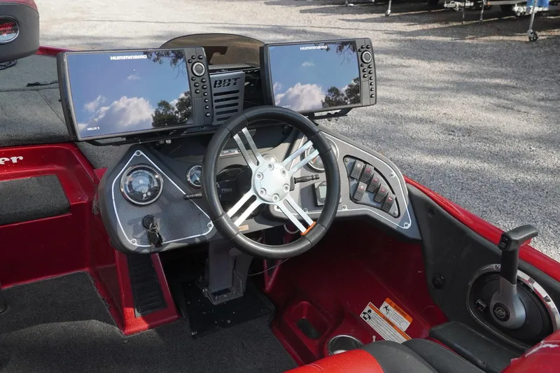 Slide: The Image of 2011 Ranger Z119 boat dashboard with dual Humminbird displays and steering wheel. - 5