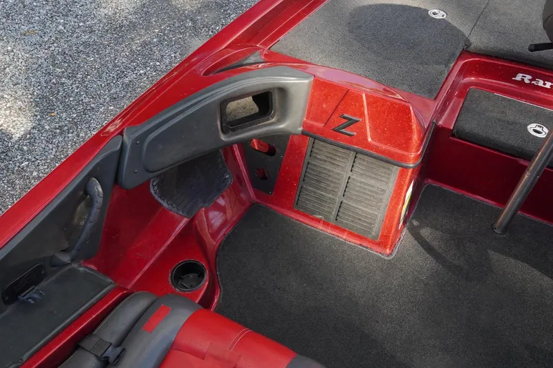 Slide: The Image of Red 2011 Ranger Z119 boat interior with carpeted flooring and seating. - 9
