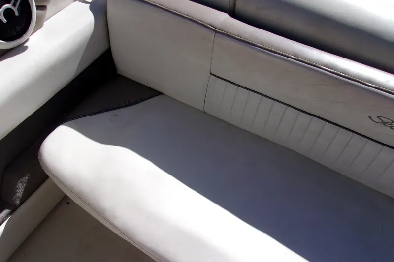 Slide: The Image of 2007 Sea Ray 210 Select boat interior with white leather seating and speaker detail. - 10