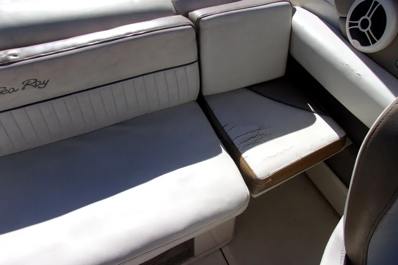 Slide: The Image of 2007 Sea Ray 210 Select boat interior with white leather seating and speaker. - 11