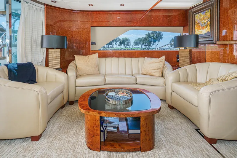 Slide: The Image of Luxurious interior of 2006 Fairline 74 Custom yacht with elegant seating and wooden accents. - 14