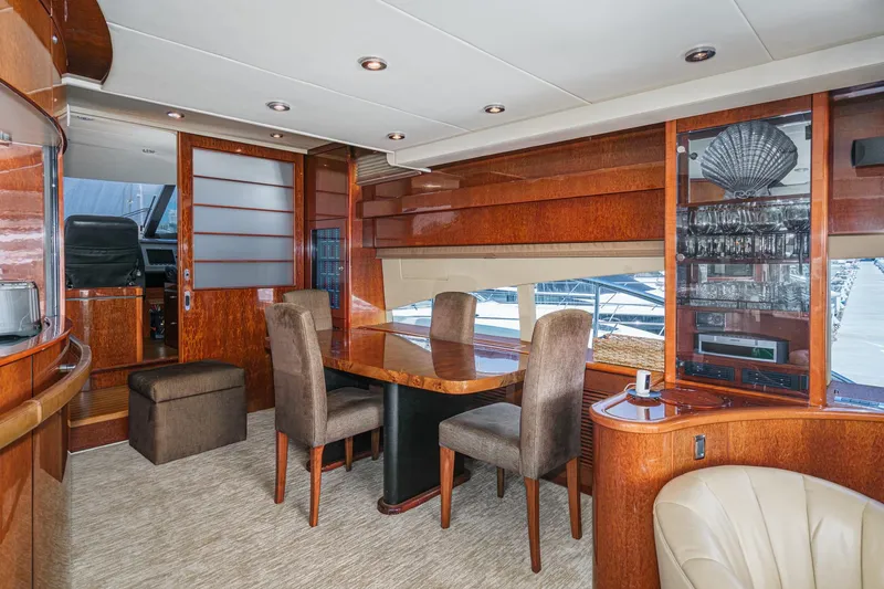 Slide: The Image of Luxurious interior of 2006 Fairline 74 Custom yacht with elegant dining area. - 15
