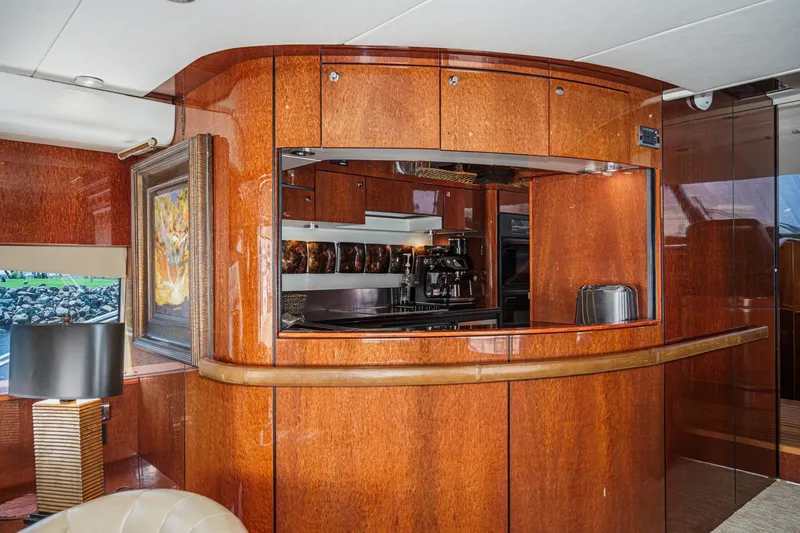 Slide: The Image of Luxurious wooden interior of 2006 Fairline 74 Custom yacht kitchen area. - 17