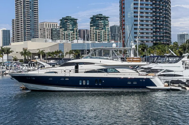 Slide: The Image of Luxury Fairline 74 Custom yacht docked in urban marina, 2006 model. - 2