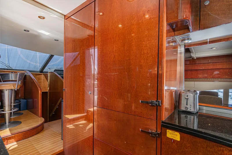 Slide: The Image of Luxurious interior of 2006 Fairline 74 Custom yacht with polished wood and modern amenities. - 21