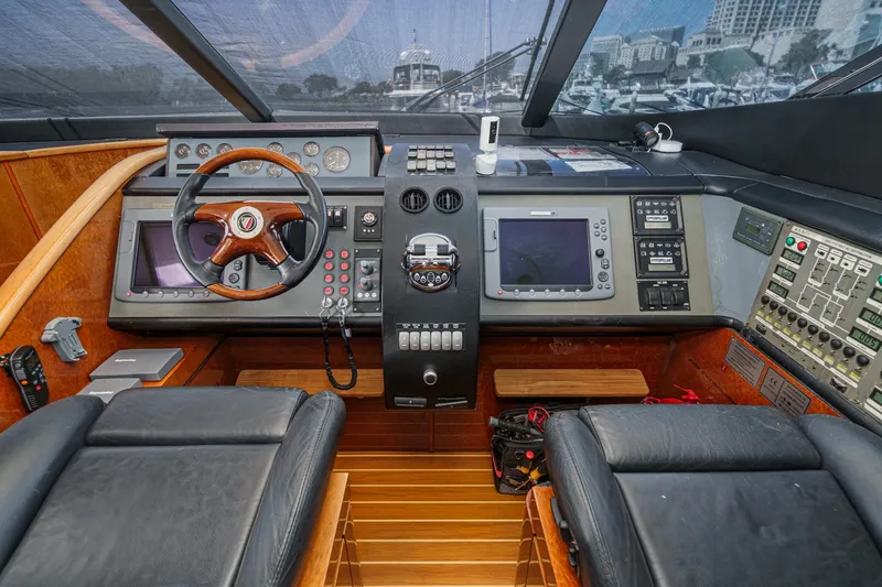 Slide: The Image of Cockpit of 2006 Fairline 74 Custom yacht with advanced navigation controls and leather seating. - 25