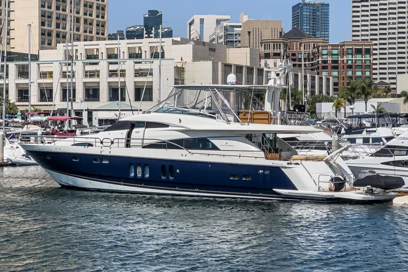 Slide: The Image of Luxury 2006 Fairline 74 Custom yacht docked in urban marina setting. - 3