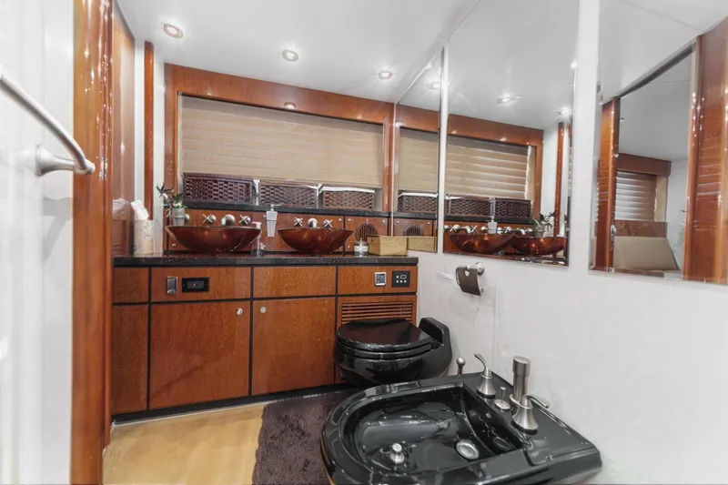 Slide: The Image of Luxurious bathroom in 2006 Fairline 74 Custom yacht with elegant wood finishes and modern fixtures. - 31