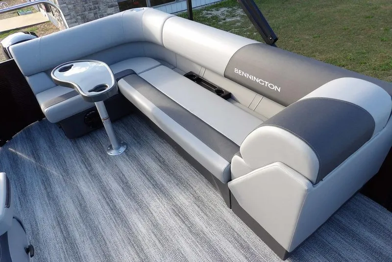 Slide: The Image of 2026 Bennington S L-Bench 22 SL boat interior with sleek seating and table. - 15