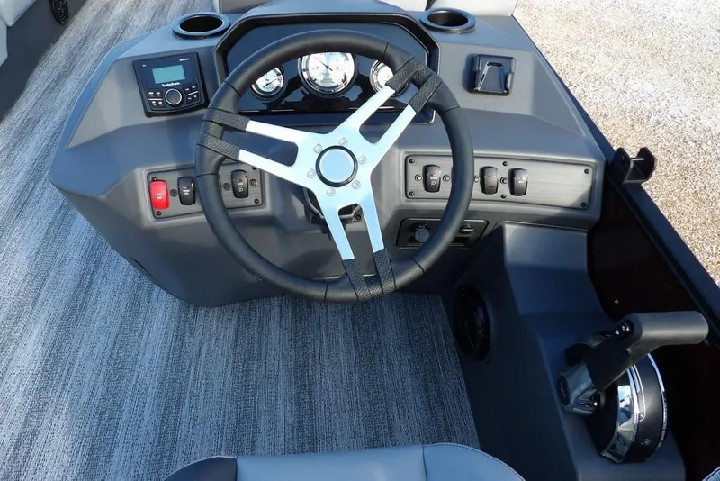 Slide: The Image of 2026 Bennington S L-Bench 22 SL boat dashboard with steering wheel and controls. - 17