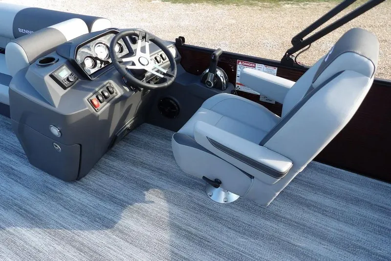 Slide: The Image of 2026 Bennington S L-Bench 22 SL boat interior with steering console and captain's chair. - 20