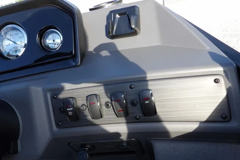 Slide: The Image of Dashboard controls of 2026 Bennington S L-Bench 22 SL boat with gauges and switches. - 24