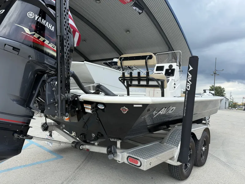 Slide: The Image of Avid 23 FS 2020 boat with Yamaha 200 engine, featuring cushioned seating and deck. - 7
