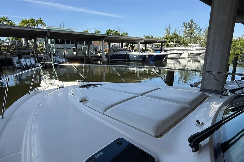 Slide: The Image of 2011 Tiara Yachts 4500 Sovran docked at marina, sunny day, calm waters. - 11