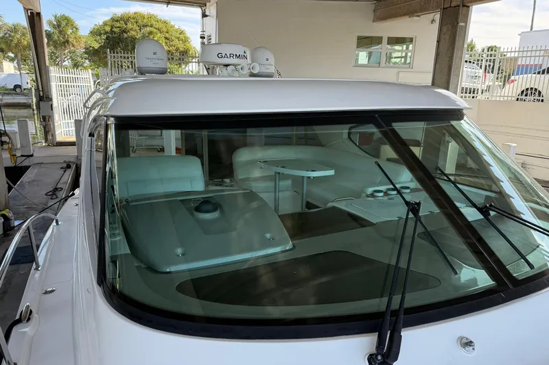 Slide: The Image of 2011 Tiara Yachts 4500 Sovran with Garmin equipment, docked in a marina. - 12