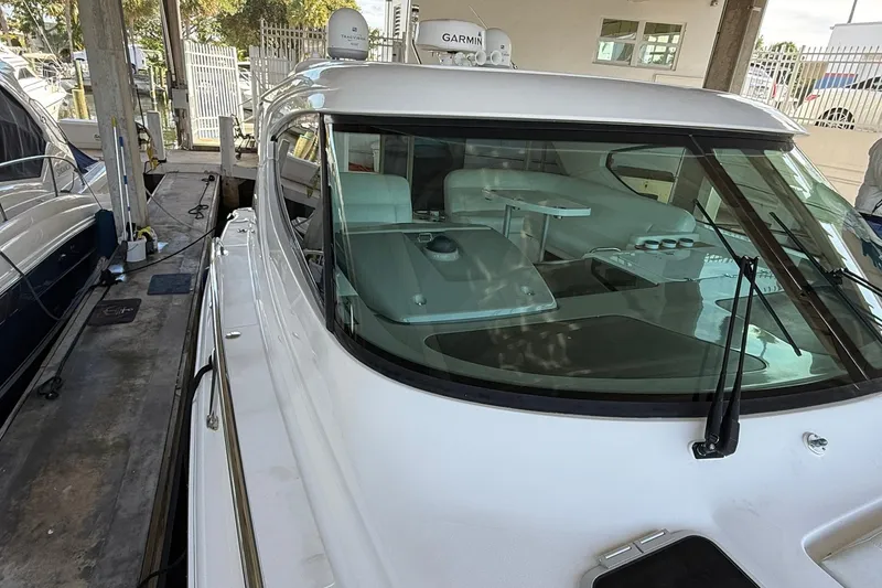 Slide: The Image of 2011 Tiara Yachts 4500 Sovran docked, showcasing sleek design and modern features. - 14