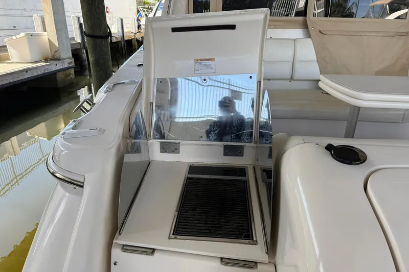 Slide: The Image of 2011 Tiara Yachts 4500 Sovran interior with grill and seating area. - 21