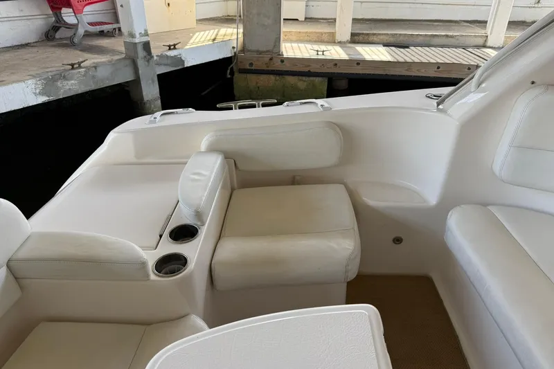 Slide: The Image of 2011 Tiara Yachts 4500 Sovran interior with white seating and cup holders. - 26