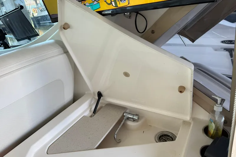 Slide: The Image of Interior sink area of a 2011 Tiara Yachts 4500 Sovran with a faucet and soap dispenser. - 32