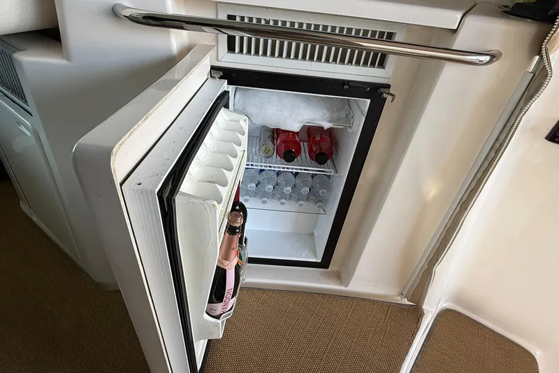 Slide: The Image of Mini fridge on 2011 Tiara Yachts 4500 Sovran, stocked with drinks. - 33