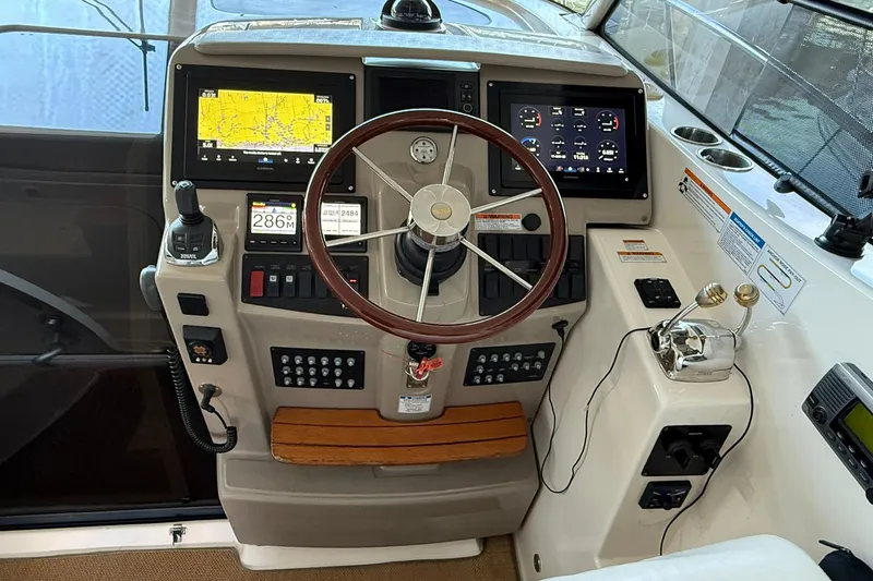 Slide: The Image of 2011 Tiara Yachts 4500 Sovran helm with navigation screens and controls. - 37