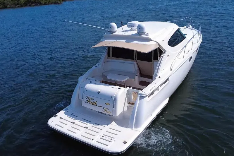 Slide: The Image of 2011 Tiara Yachts 4500 Sovran cruising on calm blue waters. - 4