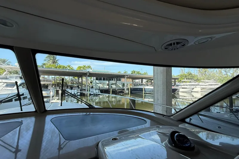 Slide: The Image of Interior view from 2011 Tiara Yachts 4500 Sovran, overlooking marina with docked boats. - 40