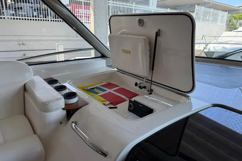 Slide: The Image of 2011 Tiara Yachts 4500 Sovran interior with storage compartment and colorful flags. - 42