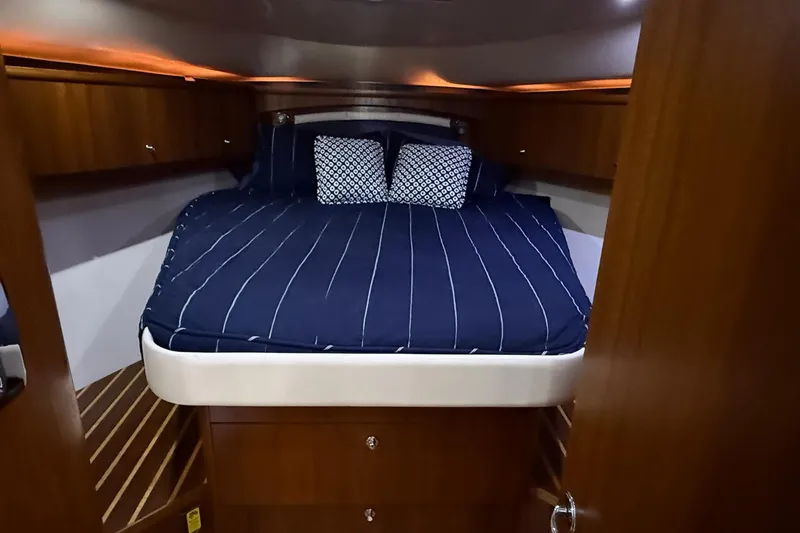 Slide: The Image of Luxurious cabin interior of 2011 Tiara Yachts 4500 Sovran with cozy bedding. - 49