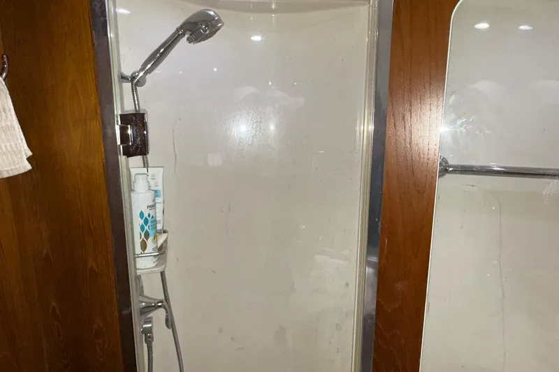 Slide: The Image of Shower area in 2011 Tiara Yachts 4500 Sovran, featuring wooden accents and modern fixtures. - 57
