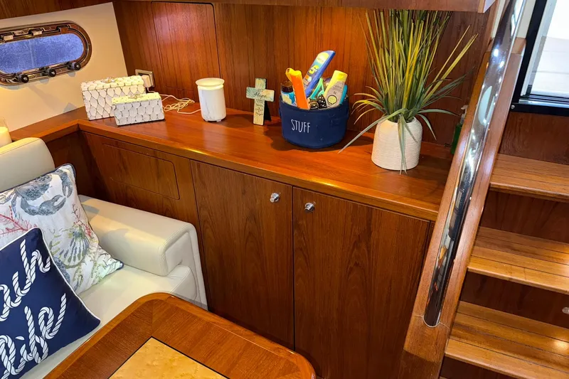 Slide: The Image of Cozy interior of 2011 Tiara Yachts 4500 Sovran with wooden cabinetry and nautical decor. - 59