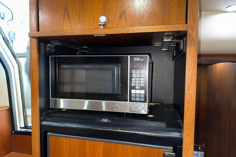 Slide: The Image of Microwave in 2011 Tiara Yachts 4500 Sovran, wooden cabinetry, modern design. - 66