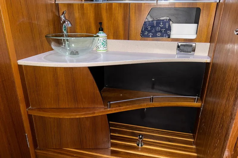 Slide: The Image of Luxurious wooden vanity with glass sink in 2011 Tiara Yachts 4500 Sovran. - 69