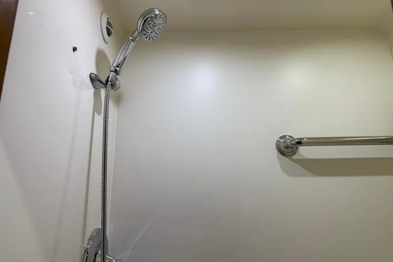 Slide: The Image of Shower area in 2011 Tiara Yachts 4500 Sovran, featuring chrome fixtures and grab bar. - 72