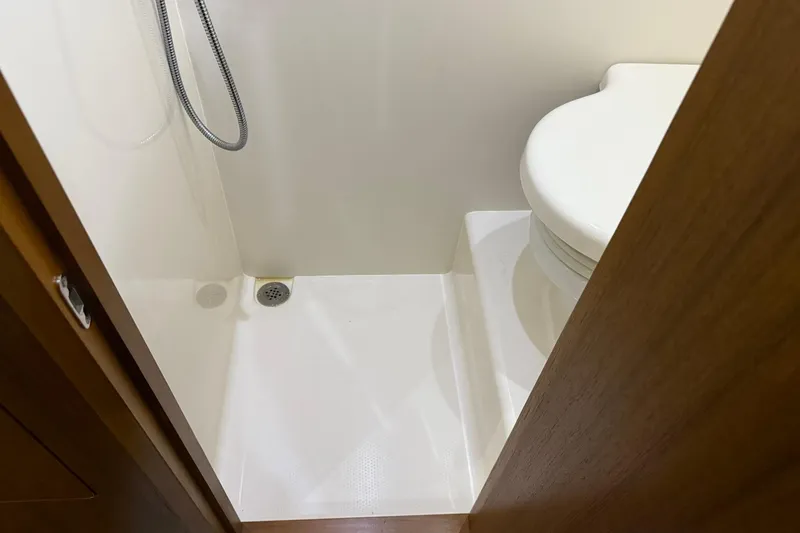 Slide: The Image of Compact bathroom in 2011 Tiara Yachts 4500 Sovran, featuring shower and toilet. - 73