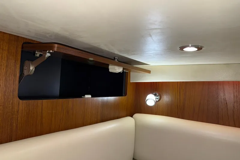 Slide: The Image of Interior of 2011 Tiara Yachts 4500 Sovran with wood paneling and modern lighting. - 77