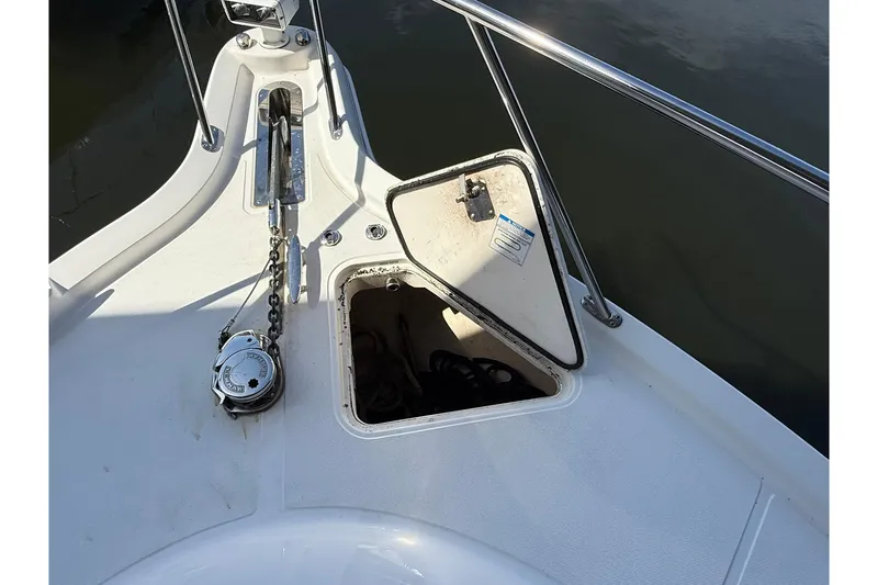 Slide: The Image of Open anchor locker on 2011 Tiara Yachts 4500 Sovran, showing chain and winch. - 8